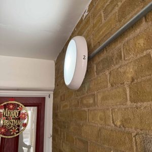 - LED wall light fitting on brick wall for property management, professional electrician services integrated.