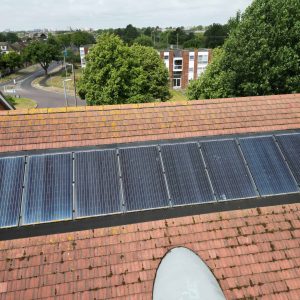 Electric solar panels installed on house roof, providing sustainable energy for property management.
